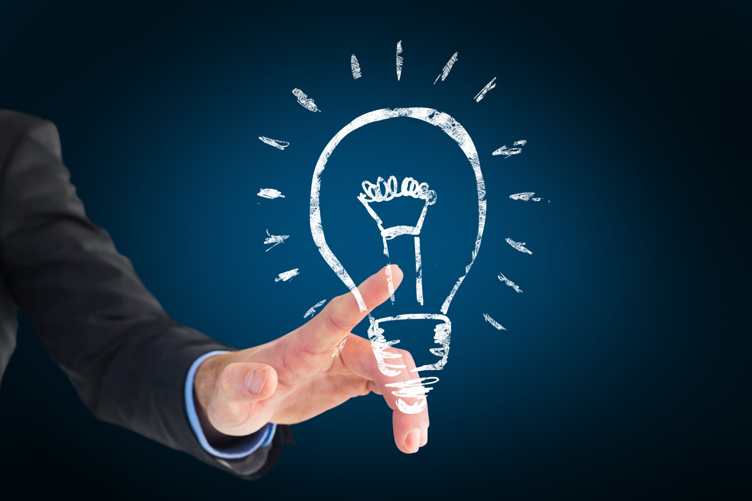 Composite image of a hand pointing light bulb with black background